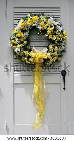 beautiful yellow and white wreath with yellow ribbon