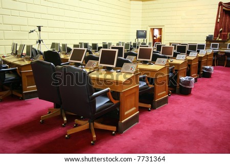 large meeting room with desks,chairs and computers
