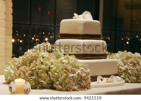 stock photo beautiful wedding cake and hydrangeas displayed on table