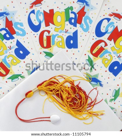white graduation cap with festive background with words \