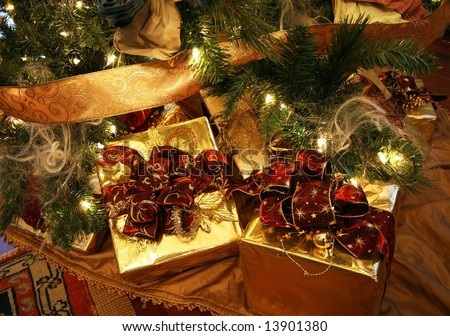 beautifully wrapped xmas presents under xmas tree