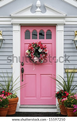 pink door with wreath