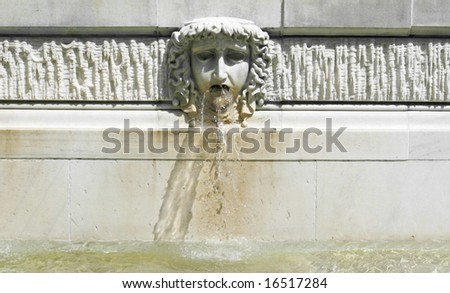decorative fountain with water spouting from mouth