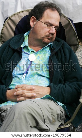 stock-photo-baby-boomer-man-sleeping-in-chair-19099354.jpg