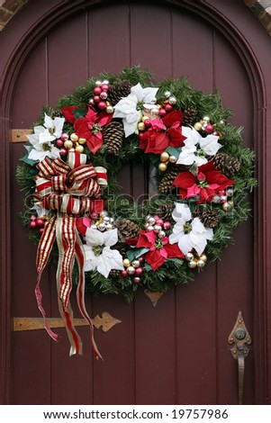 beautiful christmas wreath on brown door