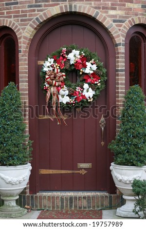 beautiful christmas wreath on brown door