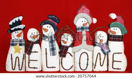 fun welcome sign with different snowmen