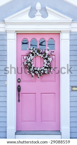 unusual pink door with wreath