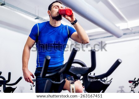Spinning Instructor at Gym after class drinking water
