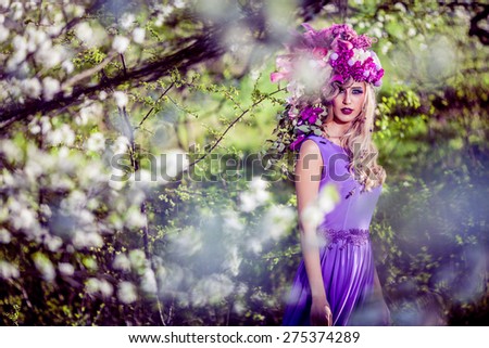 Fairies are real, beautiful Woman wearing a flower crown symbolizing spring - all images in this series shot with an open aperture - very shallow depth of field