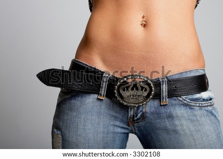 stock photo Sexy tanned woman belly shot in studio Save to a lightbox