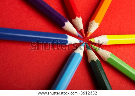 A Circle of Colored Pencils on Red Background - check my gallery for more pictures