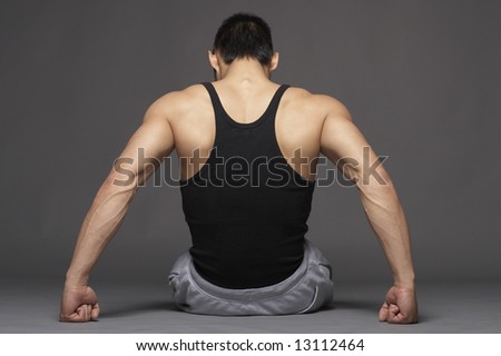 Young asian man from behind with muscular back