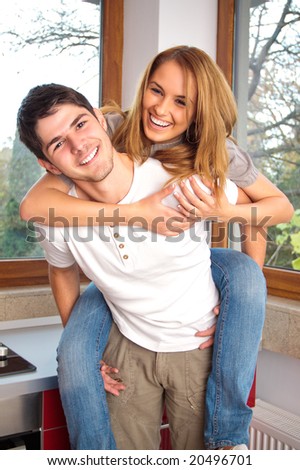 Happy young couple having inside
