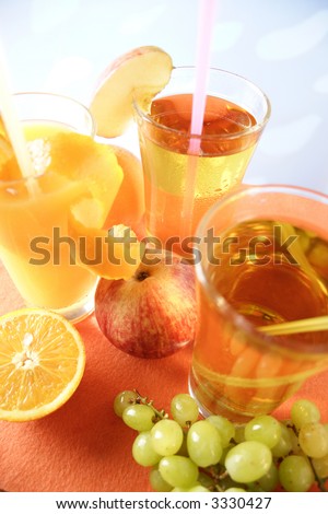 Glass of apple juice, orange juice and grape juice