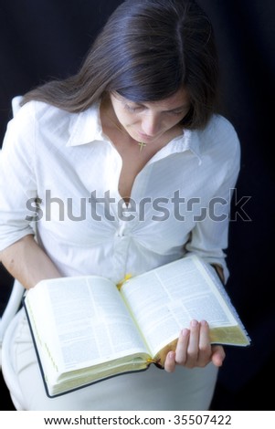 Portrait of a woman reading the bible