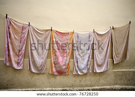 Towels are drying on a cloth line in Gallipoli, Lecce, Italy.