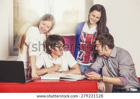 People friends working at home at the table with laptop