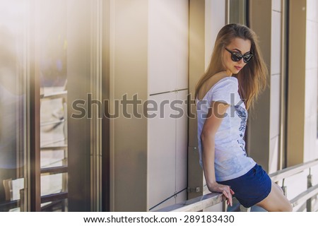 Female model on the background of modern building