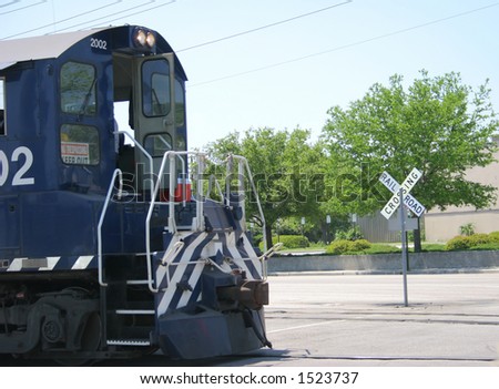 Freight Train by Railroad Crossing
