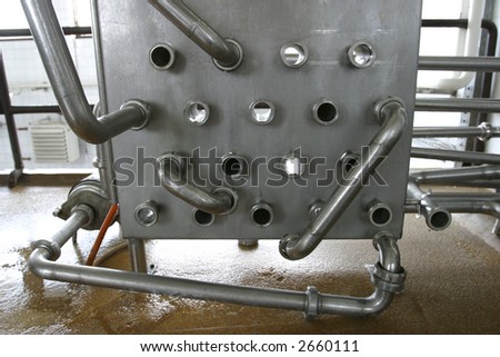 stainless steel pipes and valves in modern dairy plant