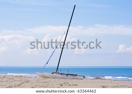 sailing catamaran on a sandy beach