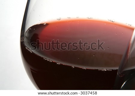 Two wine glasses with red wine close up on  grey background