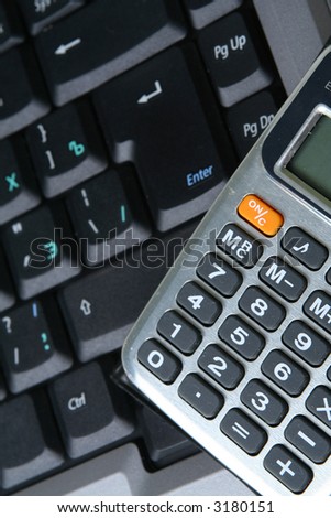 Computer keyboard glasses  calculator on a white background