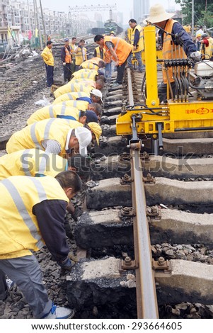Anhui Huaibei China, June 20, 2015. Railway workers laid the railway. By 2015, China's railway mileage will reach 120000 kilometers or more.
