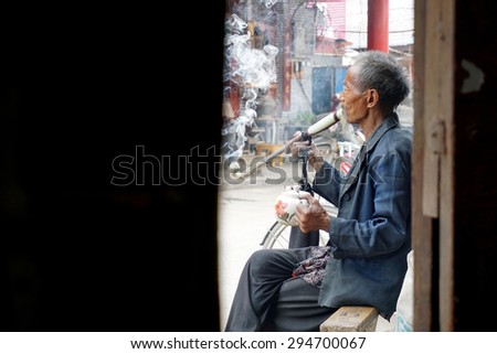 Huaibei, Anhui, Chinese, June 7, 2015, an old man in Linhuan teahouse tea. Formed from the Chinese Linhuan teahouse in Tang Dynasty, has been 600 years of history.
