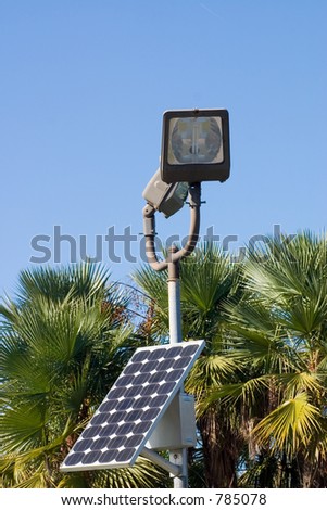 Solar panel generating clean electricity to run street light when night comes.