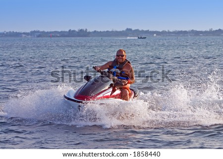 Man on jet ski in motion