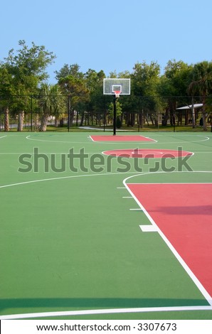 Basketball backboard and hoop at end of court