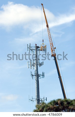 Cell phone company upgrading a communications tower