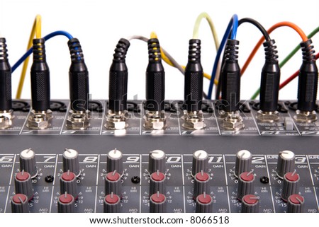 Audio mixboard closeup with wiring connections isolated over white