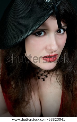 stock photo sexy busty woman wearing vintage hat with tassle and low cut 