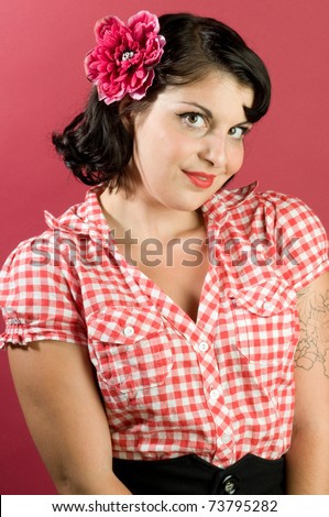 Pretty country pin up model wearing red and white checked shirt