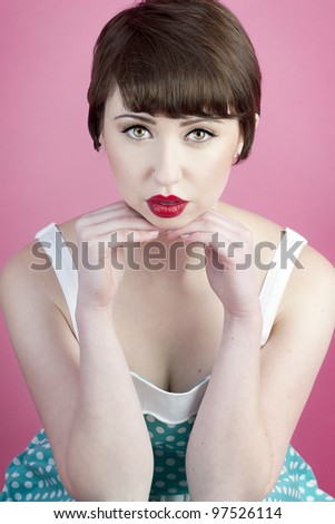 Cute pin up model with full lips and pixie haircut