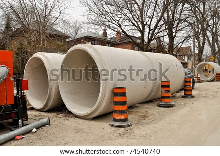 Concrete sewage pipes on residential street
