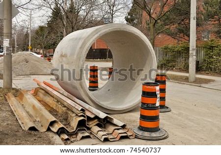 Concrete sewage pipes on residential street