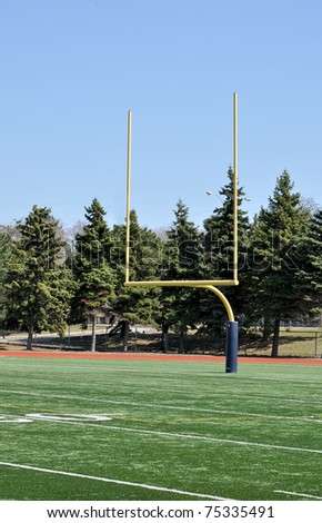North American Football posts on field on sunny day