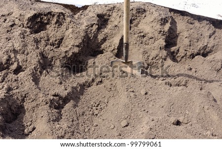 pile of organic compost with shovel