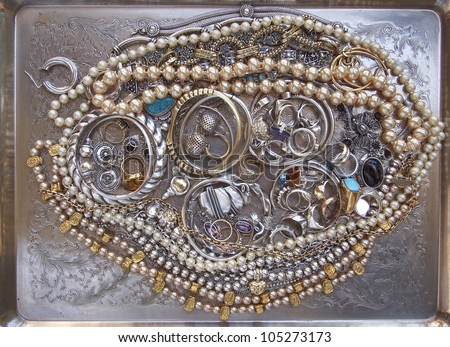 variety of gold and silver jewels, precious background