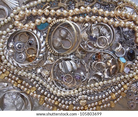 variety of gold and silver jewels closeup