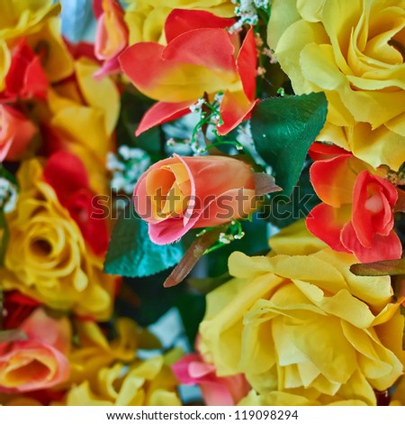 variety of colorful fake roses, floral background