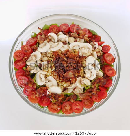 Tomato salad with mushrooms and bacon