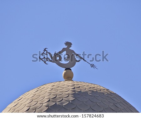 classical building dome detail, with Triton (ancient Greek deity) as wind vane, Athens