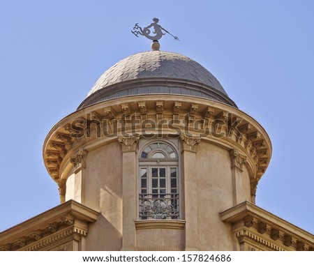 classical building dome with Triton ancient Greek deity as wind vane, Athens