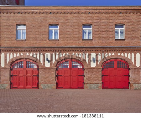 three red doors and four windows, fire squad station, in Saxony, Germany