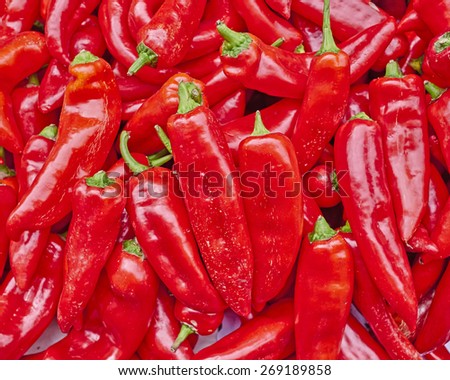 huge red hot chili peppers close up, natural background